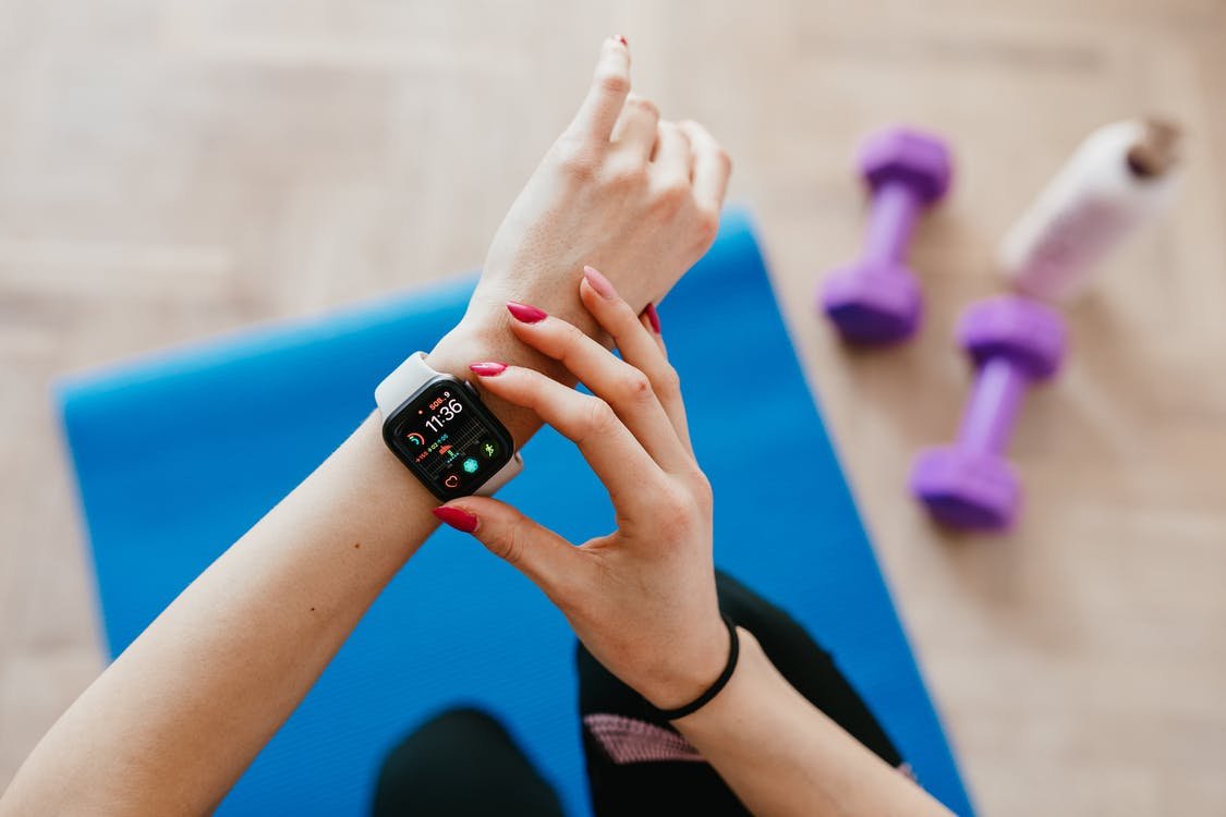lady checking fitness watch