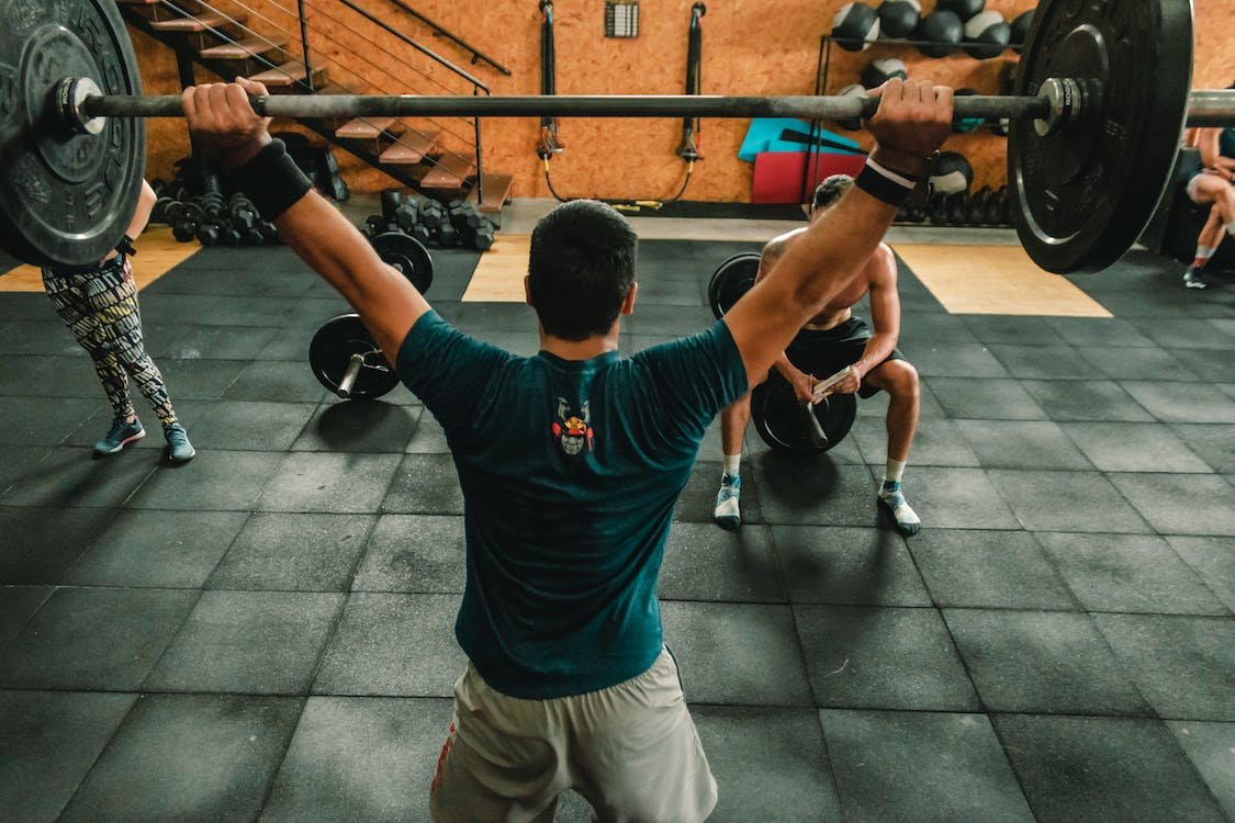 man lifting a barbell